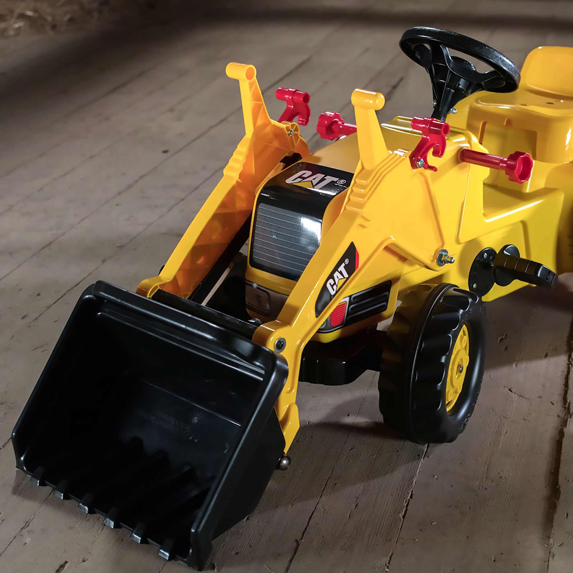 Closeup image of the front end of hte CAT Kid tractor