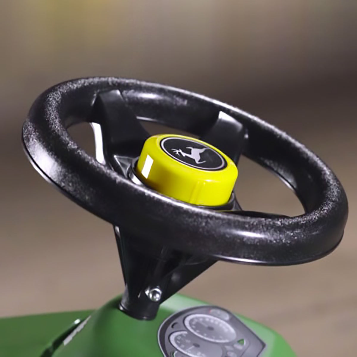 Steering wheel of the John Deere Minitrac Foot to Floor Ride-On