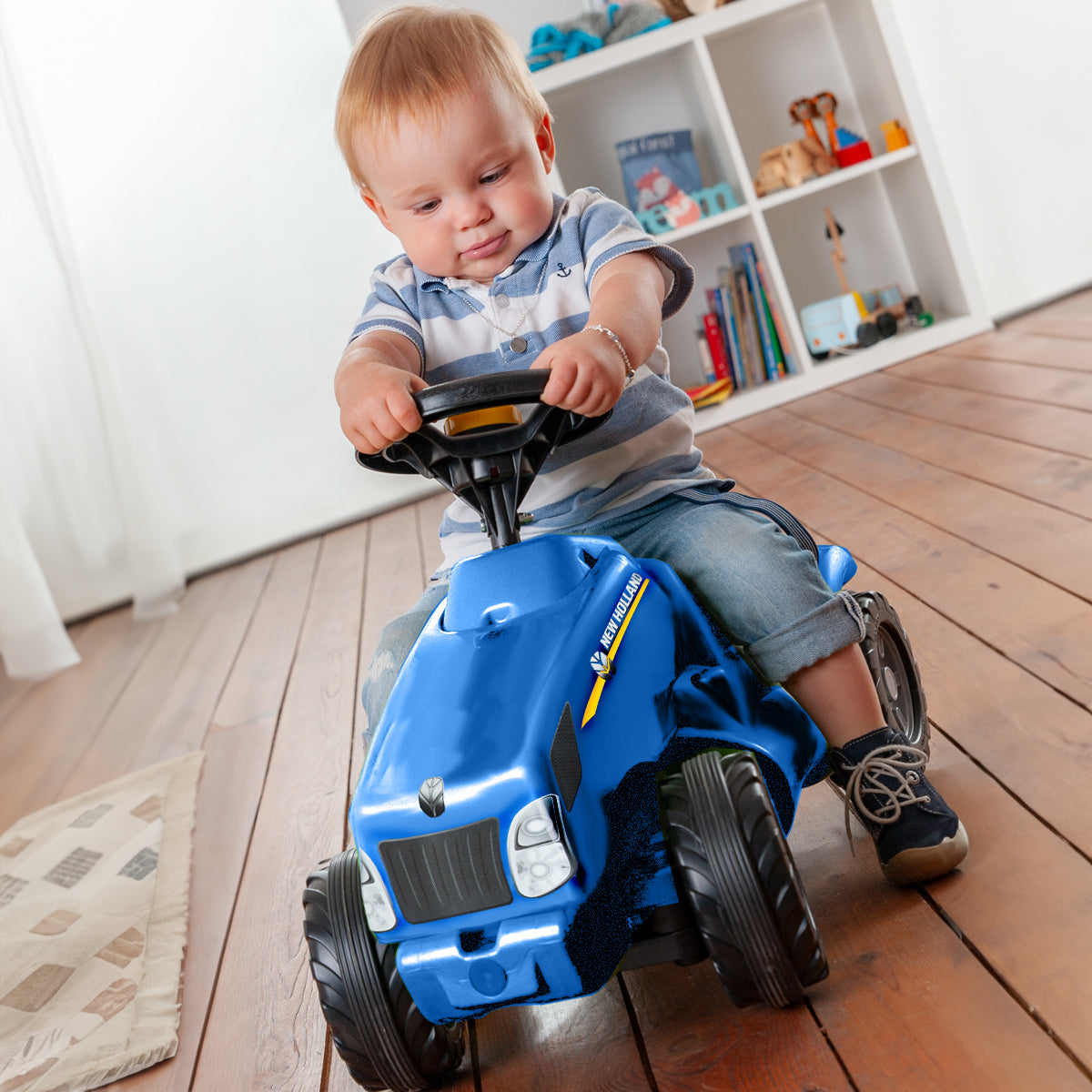 Lifestyle image of the New Holland Minitrac Foot to Floor Ride-On
