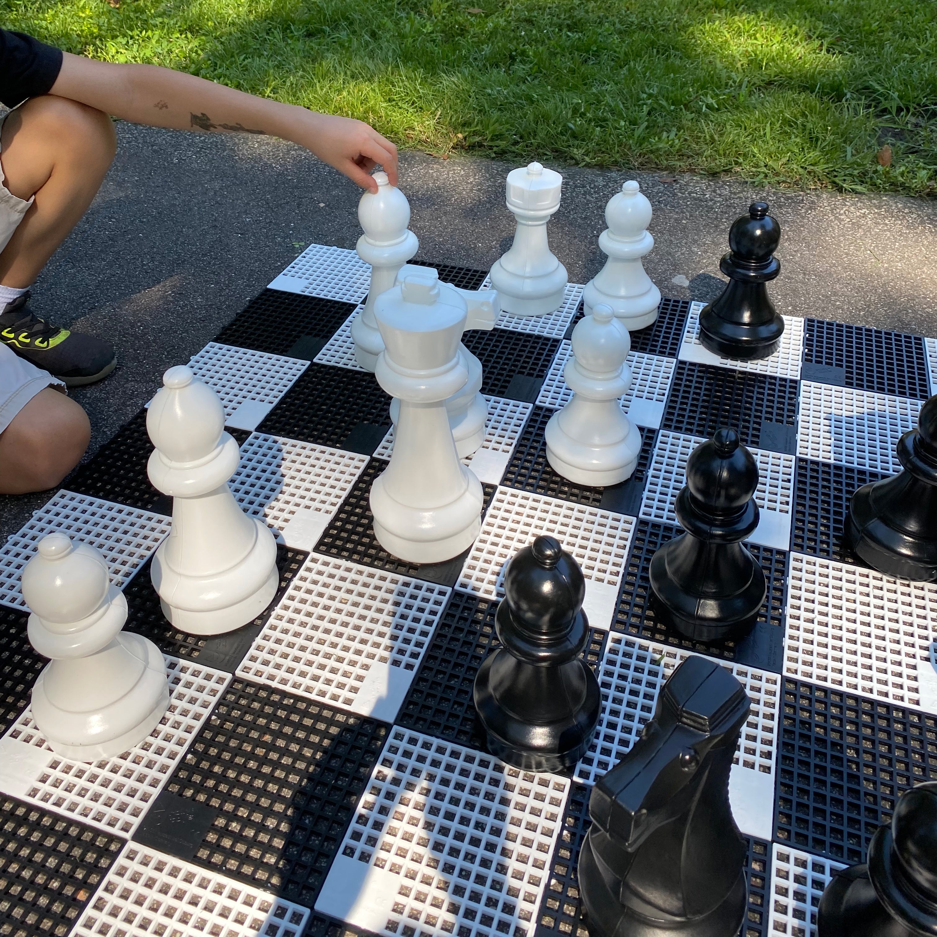Closeup of Kids playing outside on the Mini-Giant Chess Set