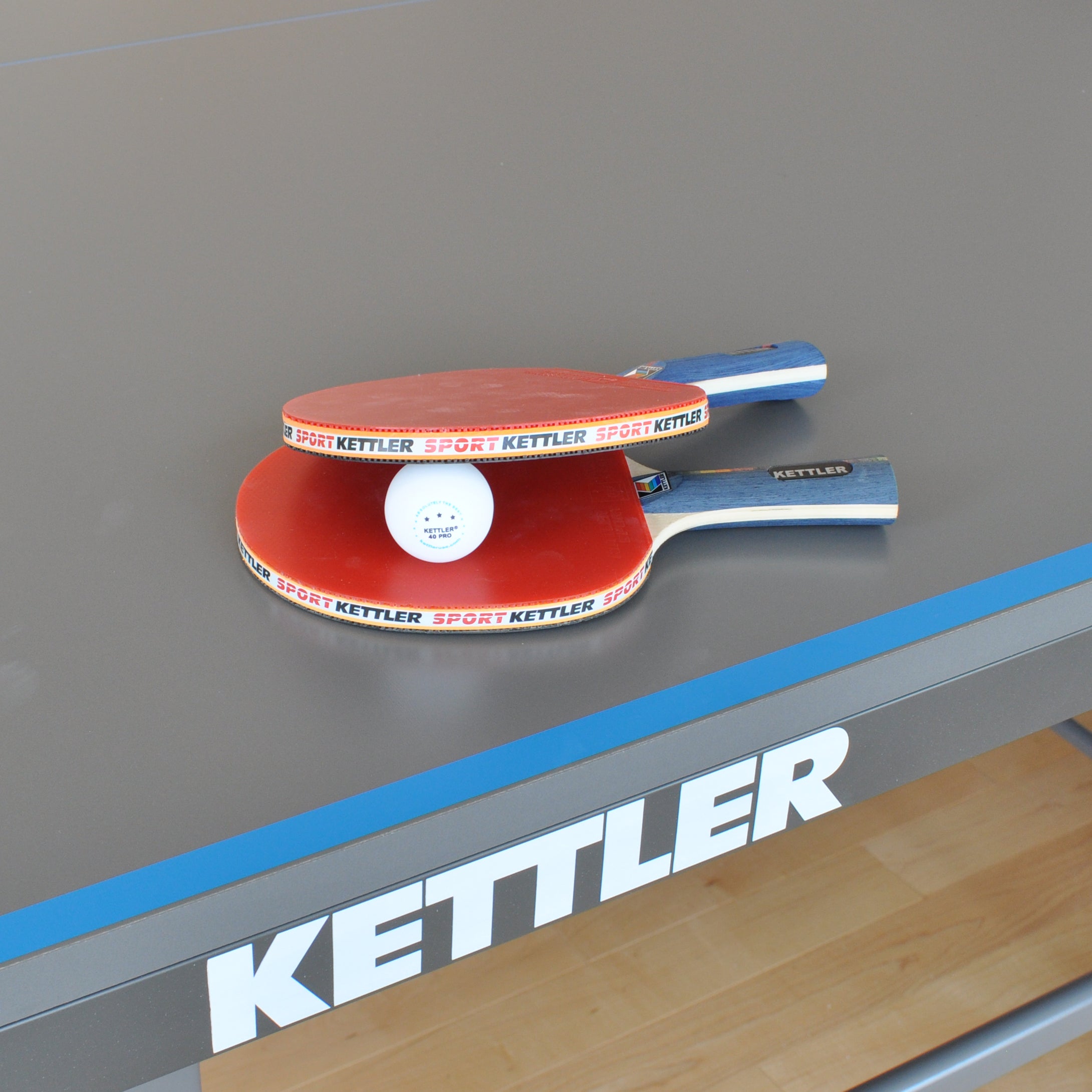 GTX-85 4-Player Set rackets and ball on a table tennis table