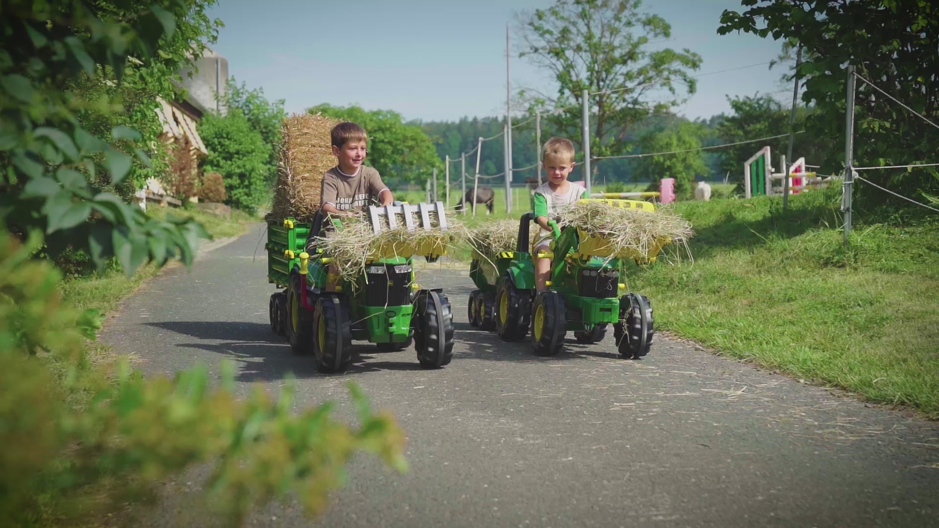 Video of Lifestyle of boys playing with the John Deere Pedal Tractor with Loader